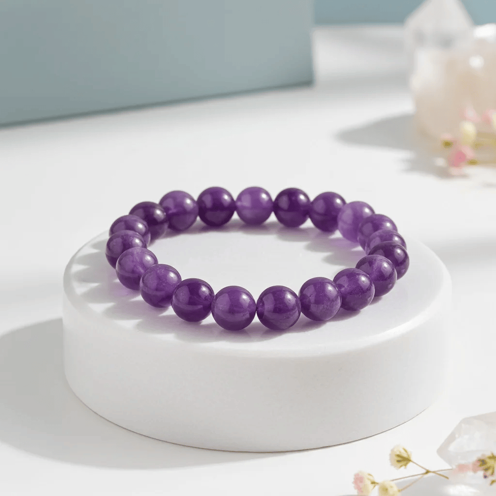 Amethyst bracelet benefits — natural purple healing crystal bracelet on wrist